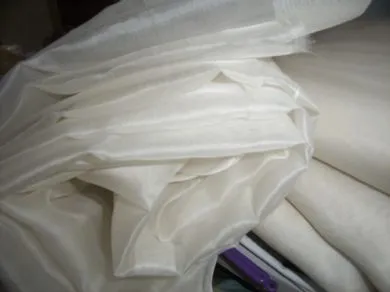 silk organza off white{light ivory} 110 inches wide{279 cms}.